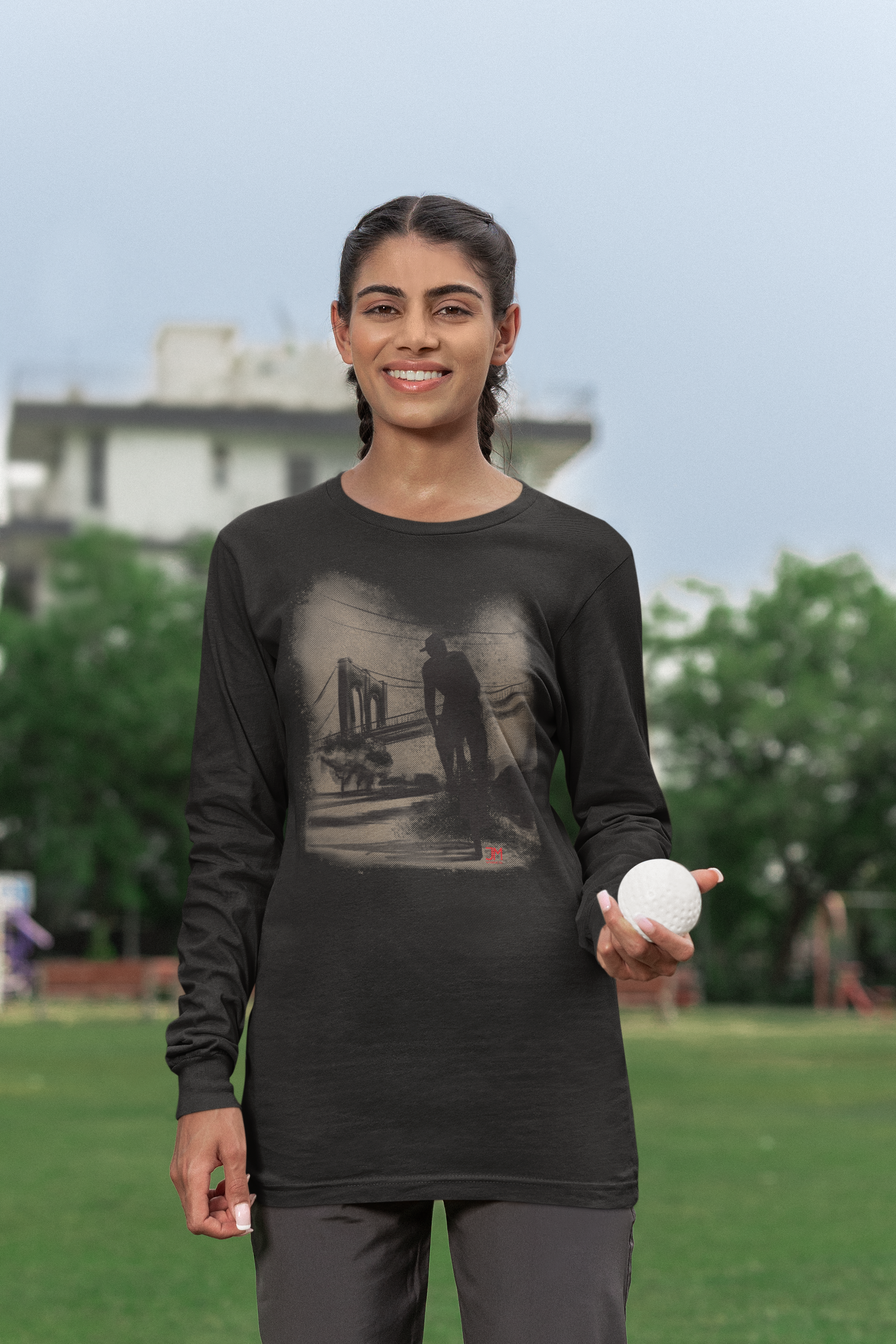 bella-canvas-long-sleeve-tee-mockup-of-a-smiling-woman-holding-a-cricket-ball-m40008.png